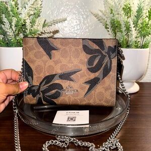 COACH Crossbody In Signature Canvas With Black Bow Print CY746